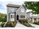 Charming two-story home featuring gray siding, manicured landscaping, and a welcoming front entrance at 2941 Lookout Ne Pl, Atlanta, GA 30305