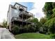 Multi-level deck with backyard and lush landscaping on a beautiful gray home exterior at 2941 Lookout Ne Pl, Atlanta, GA 30305