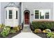 Inviting front entrance with wooden door, bay window, and lovely landscaping at 2941 Lookout Ne Pl, Atlanta, GA 30305