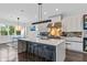 Modern kitchen with large island, quartz countertops, sleek cabinetry, and stainless steel appliances at 2941 Lookout Ne Pl, Atlanta, GA 30305