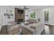 Bright living room with fireplace, built-in shelving, comfortable seating, and access to the outdoors at 2941 Lookout Ne Pl, Atlanta, GA 30305