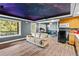 Entertainment room with custom ceiling, kitchenette, and workout area at 2941 Lookout Ne Pl, Atlanta, GA 30305