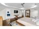 Bedroom suite featuring hardwood floors, a large mirror, and tray ceilings at 2941 Lookout Ne Pl, Atlanta, GA 30305