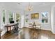 Home office featuring hardwood floors, natural light, elegant decor, and a comfortable workspace at 2941 Lookout Ne Pl, Atlanta, GA 30305