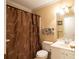 Bathroom with white vanity, shower curtain with butterfly design and chrome fixtures at 210 Huiet Dr, Mcdonough, GA 30252