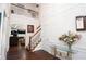 Bright foyer with hardwood floors, staircase, and view of the living room at 210 Huiet Dr, Mcdonough, GA 30252