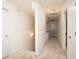 Bright upstairs hallway with neutral paint and carpet and traditional doors at 210 Huiet Dr, Mcdonough, GA 30252