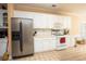 Spacious kitchen with stainless steel appliances and white cabinetry at 210 Huiet Dr, Mcdonough, GA 30252