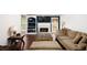 Inviting living room features fireplace, built-in shelves, and wood flooring at 210 Huiet Dr, Mcdonough, GA 30252
