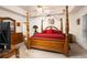 Cozy bedroom with four-poster bed, soft lighting, and ample closet space at 210 Huiet Dr, Mcdonough, GA 30252