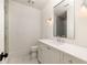 Modern bathroom with white vanity, marble floor, and glass shower at 10939 Serenbe Ln, Chattahoochee Hills, GA 30268