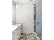 Chic bathroom featuring marble floors, a sleek vanity, and glass-enclosed shower at 10939 Serenbe Ln, Chattahoochee Hills, GA 30268