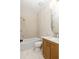 Neutral toned bathroom featuring wood vanity, marble floors, and shower-tub combo at 10939 Serenbe Ln, Chattahoochee Hills, GA 30268