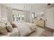 Serene bedroom featuring warm tones, ample natural light, and classic furnishings at 10939 Serenbe Ln, Chattahoochee Hills, GA 30268