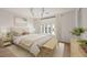 Bright bedroom with large windows, neutral decor, and stylish furniture at 10939 Serenbe Ln, Chattahoochee Hills, GA 30268