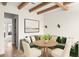 Cozy dining nook with green upholstered seating and stylish decor at 10939 Serenbe Ln, Chattahoochee Hills, GA 30268