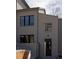 Modern multi-story building featuring minimalist design, and black-framed windows at 10939 Serenbe Ln, Chattahoochee Hills, GA 30268