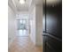 Open entryway showcases tile flooring leading to a bright living area with balcony access and modern finishes at 285 Centennial Olympic Park Nw Dr # 903, Atlanta, GA 30313