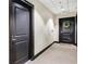 Hallway featuring carpet and apartment doors, creating a well-maintained and inviting atmosphere for residents at 285 Centennial Olympic Park Nw Dr # 903, Atlanta, GA 30313
