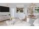 This image is virtually staged. Bright living space with modern decor, open to the kitchen, perfect for stylish and comfortable living at 285 Centennial Olympic Park Nw Dr # 903, Atlanta, GA 30313
