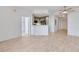 Open living space featuring wood floors, a modern kitchen, and ample natural light, creating an inviting atmosphere at 285 Centennial Olympic Park Nw Dr # 903, Atlanta, GA 30313