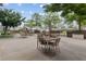 Outdoor patio with tables, chairs, umbrellas, and grill stations, perfect for gatherings and relaxation at 285 Centennial Olympic Park Nw Dr # 903, Atlanta, GA 30313