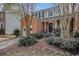 Charming two-story home with brick accents, a one-car garage, and mature landscaping in a neighborhood setting at 3187 Kingswood Gln, Decatur, GA 30034