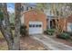 Attached one car garage and landscaped front yard create a welcoming curb appeal for this brick accented home at 3187 Kingswood Gln, Decatur, GA 30034