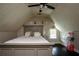 Bedroom with a gray bed frame and dark wood floors at 503 Mary Margaret Walk, Loganville, GA 30052