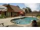 Inviting freeform swimming pool with flagstone coping, steps, and a relaxing patio area at 503 Mary Margaret Walk, Loganville, GA 30052