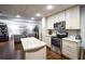 Basement kitchen features granite countertops and stainless steel appliances at 160 Edgewater Trl, Fayetteville, GA 30215