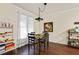 Charming dining area features hardwood floors, a modern light fixture, and ample natural light at 228 Shady Ln, Canton, GA 30115