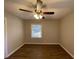 Spacious bedroom featuring hardwood floors and ceiling fan at 1885 Broad Ave, East Point, GA 30344