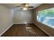 Bright living room with hardwood floors and large window at 1885 Broad Ave, East Point, GA 30344