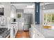 Modern kitchen with white cabinets, stainless steel appliances, and hardwood floors at 1284 Druid Ne Pl, Atlanta, GA 30307