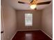 Bright bedroom with hardwood floors and a window with blinds at 5914 Sara Ashley Ct, Lithonia, GA 30058