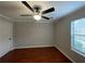 Well-lit bedroom with hardwood floors and a ceiling fan at 5914 Sara Ashley Ct, Lithonia, GA 30058