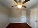 Bright bedroom with ceiling fan and hardwood floors at 5914 Sara Ashley Ct, Lithonia, GA 30058