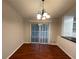 Spacious dining area with hardwood floors and access to a deck or patio at 5914 Sara Ashley Ct, Lithonia, GA 30058