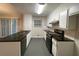 Updated kitchen with granite countertops and stainless steel appliances at 5914 Sara Ashley Ct, Lithonia, GA 30058
