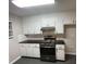 Updated kitchen with granite countertops and stainless steel appliances at 5914 Sara Ashley Ct, Lithonia, GA 30058