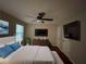 Spacious main bedroom with hardwood floors and ceiling fan at 5914 Sara Ashley Ct, Lithonia, GA 30058