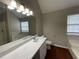 Main bathroom with a large vanity, soaking tub, and shower at 3063 Stonebridge Creek Dr, Lithonia, GA 30058