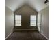Well-lit bedroom with neutral walls and carpet flooring at 3063 Stonebridge Creek Dr, Lithonia, GA 30058