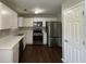 Modern kitchen with stainless steel appliances and white cabinets at 3063 Stonebridge Creek Dr, Lithonia, GA 30058