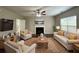 Spacious living room featuring a fireplace and ample seating at 3063 Stonebridge Creek Dr, Lithonia, GA 30058