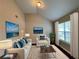 Bright living room with vaulted ceiling, comfy sofas, and large windows at 3063 Stonebridge Creek Dr, Lithonia, GA 30058