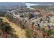 Scenic aerial view of a neighborhood near lake and golf course, with colorful foliage at 424 Lake Point Trce, Canton, GA 30114
