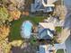 Overhead shot of a home featuring a private swimming pool, spacious lawn, and manicured landscaping at 424 Lake Point Trce, Canton, GA 30114