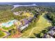 Beautiful aerial view of a neighborhood with a golf course, lake, and lush green trees at 424 Lake Point Trce, Canton, GA 30114
